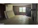 Spacious living room featuring a stone fireplace and large windows for natural light at 372 Nalley Dr, Stone Mountain, GA 30087