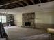 Living room with stone fireplace, hardwood flooring and exposed ceilings at 372 Nalley Dr, Stone Mountain, GA 30087