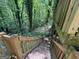 Wooden stairs leading down to a wooded area at 372 Nalley Dr, Stone Mountain, GA 30087