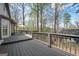 Spacious deck featuring wood railings and partial view of outdoor dining space at 2689 Spring Rock Ne Ct, Roswell, GA 30075