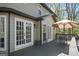 Wooden deck with outdoor seating, an umbrella, and access to the home's interior at 2689 Spring Rock Ne Ct, Roswell, GA 30075