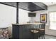 Basement bar area with granite countertop and seating for entertaining at 2689 Spring Rock Ne Ct, Roswell, GA 30075