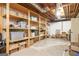 Unfinished basement with open shelving, storage containers and boxes at 2689 Spring Rock Ne Ct, Roswell, GA 30075