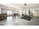 Basement with workout equipment, seating area, and walkout to backyard at 2689 Spring Rock Ne Ct, Roswell, GA 30075