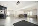 Large basement with multiple windows, wainscotting, a bar, and a seating area at 2689 Spring Rock Ne Ct, Roswell, GA 30075