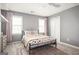 Comfortable bedroom with two windows, gray walls, and cozy decor at 2689 Spring Rock Ne Ct, Roswell, GA 30075