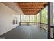 View of a spacious wooden deck with string lights, providing a cozy outdoor space at 2689 Spring Rock Ne Ct, Roswell, GA 30075