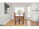 Dining room featuring a wooden table, six chairs, and double doors to the exterior at 2689 Spring Rock Ne Ct, Roswell, GA 30075