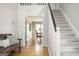 Inviting entryway with hardwood floors, staircase, and doorway leading to dining room at 2689 Spring Rock Ne Ct, Roswell, GA 30075