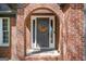 Inviting front entrance with a decorative floral wreath on the front door with sidelights at 2689 Spring Rock Ne Ct, Roswell, GA 30075
