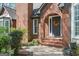 Close-up of the front entrance, showcasing the arched brick entryway and decorative wreath on the front door at 2689 Spring Rock Ne Ct, Roswell, GA 30075