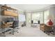 Comfortable living room with desk, shelving unit and bay window at 2689 Spring Rock Ne Ct, Roswell, GA 30075