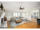 Spacious living room with fireplace, hardwood floors, and access to the kitchen at 2689 Spring Rock Ne Ct, Roswell, GA 30075