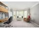 Spacious living room with bright windows, neutral walls, and carpeted floor at 2689 Spring Rock Ne Ct, Roswell, GA 30075