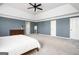 Spacious main bedroom with tray ceiling, carpet, and plenty of natural light at 2689 Spring Rock Ne Ct, Roswell, GA 30075