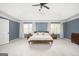 Large main bedroom featuring tray ceiling, neutral carpet, and large windows at 2689 Spring Rock Ne Ct, Roswell, GA 30075