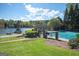 Community pool with pristine lake view, picnic area, and lush landscaping at 2689 Spring Rock Ne Ct, Roswell, GA 30075