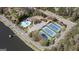 Aerial view of community tennis courts, pool, and access to the serene lake at 2689 Spring Rock Ne Ct, Roswell, GA 30075