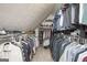 Walk-in closet features custom shelving, hanging rods, and ample storage space at 2689 Spring Rock Ne Ct, Roswell, GA 30075