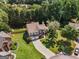 Beautiful property with lush landscaping, mature trees, and a long drive, showcasing a welcoming and well-maintained residence at 2740 Greymont Ct, Cumming, GA 30041