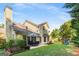 Expansive backyard features lush greenery, an outdoor dining set, and a fun playground at 2740 Greymont Ct, Cumming, GA 30041