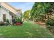 Expansive backyard featuring lush lawn and play equipment for outdoor fun and relaxation at 2740 Greymont Ct, Cumming, GA 30041
