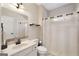Bathroom with neutral colors, shower with white curtain, and modern sink at 2740 Greymont Ct, Cumming, GA 30041
