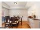 Elegant dining room featuring tray ceilings, hardwood floors, and traditional furnishings at 2740 Greymont Ct, Cumming, GA 30041