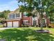 Lovely two-story home with brick, siding, attached garage, and mature landscaping at 2740 Greymont Ct, Cumming, GA 30041