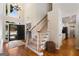 Grand foyer with hardwood floors, staircase, and large windows for natural light at 2740 Greymont Ct, Cumming, GA 30041