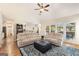 Open living room featuring high ceilings, large windows, and hardwood floors at 2740 Greymont Ct, Cumming, GA 30041