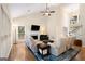 Spacious living room with vaulted ceilings, fireplace, large windows, and hardwood floors at 2740 Greymont Ct, Cumming, GA 30041