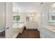 Luxurious main bathroom with a glass-enclosed shower, soaking tub, and double vanity at 2740 Greymont Ct, Cumming, GA 30041