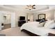 Relaxing main bedroom boasting a trey ceiling, ceiling fan, and access to a spacious en suite bathroom at 2740 Greymont Ct, Cumming, GA 30041
