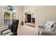 Inviting home office with natural light, a comfortable chair, and view of the outdoors at 2740 Greymont Ct, Cumming, GA 30041