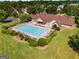 Aerial view of the community pool with lounge chairs and meticulously maintained landscaping at 2740 Greymont Ct, Cumming, GA 30041