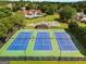 Community features three well-maintained tennis courts with lighting and seating for recreational enjoyment at 2740 Greymont Ct, Cumming, GA 30041