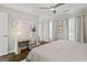 A serene main bedroom is complete with natural light, a ceiling fan, and neutral decor at 4113 Ashford Green Dr, Duluth, GA 30096