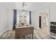 The dining room features wood floors, a modern light fixture, and access to the kitchen at 4113 Ashford Green Dr, Duluth, GA 30096