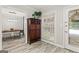 An entryway leads to the dining room featuring wood floors and natural light at 4113 Ashford Green Dr, Duluth, GA 30096