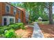 Exterior view showcasing a gazebo down a walkway on the property with mature tree coverage at 4113 Ashford Green Dr, Duluth, GA 30096