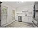 This all-white kitchen is complete with stainless steel appliances and subway tile backsplash at 4113 Ashford Green Dr, Duluth, GA 30096