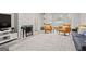 Bright living room featuring a decorative fireplace, modern furnishings, and neutral decor at 4113 Ashford Green Dr, Duluth, GA 30096