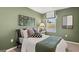 Comfortable bedroom with contemporary decor, a cozy bed, and plenty of natural light at 2810 Georgia Aster Nw Way # 6, Atlanta, GA 30318