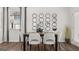 Dining room features a modern aesthetic, enhanced by stylish lighting and sleek furniture at 2810 Georgia Aster Nw Way # 6, Atlanta, GA 30318