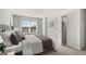 Serene main bedroom with plush bedding, ample natural light, and a spacious walk-in closet at 2810 Georgia Aster Nw Way # 6, Atlanta, GA 30318