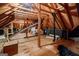 Spacious unfinished attic with wooden beams offering potential for storage or customization at 3030 Spalding Dr, Sandy Springs, GA 30350