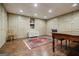 Spacious room with built in cabinetry and storage, hardwood flooring, and recessed lighting at 3030 Spalding Dr, Sandy Springs, GA 30350