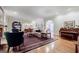Elegant living room with hardwood floors, fireplace, built-in shelving, and classic furnishings at 3030 Spalding Dr, Sandy Springs, GA 30350