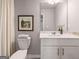 Bathroom with a white vanity, a framed landscape art print, and neutral paint color at 5615 Hislop Ln # 82, Mableton, GA 30126